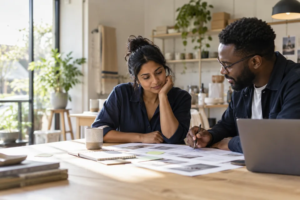 Two business professionals reviewing a marketing plan
