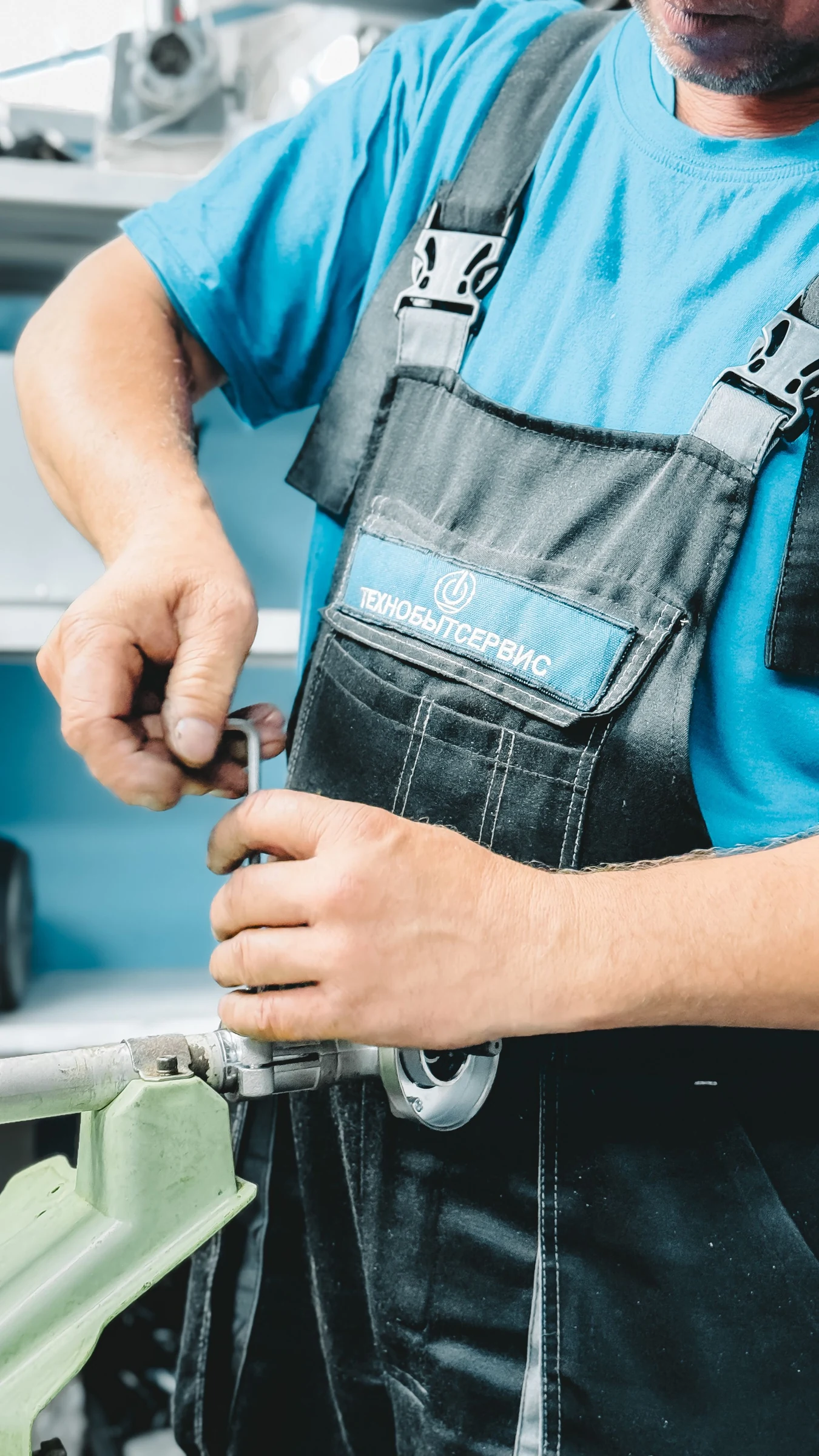 Plumber using a wrench to repair a pipe